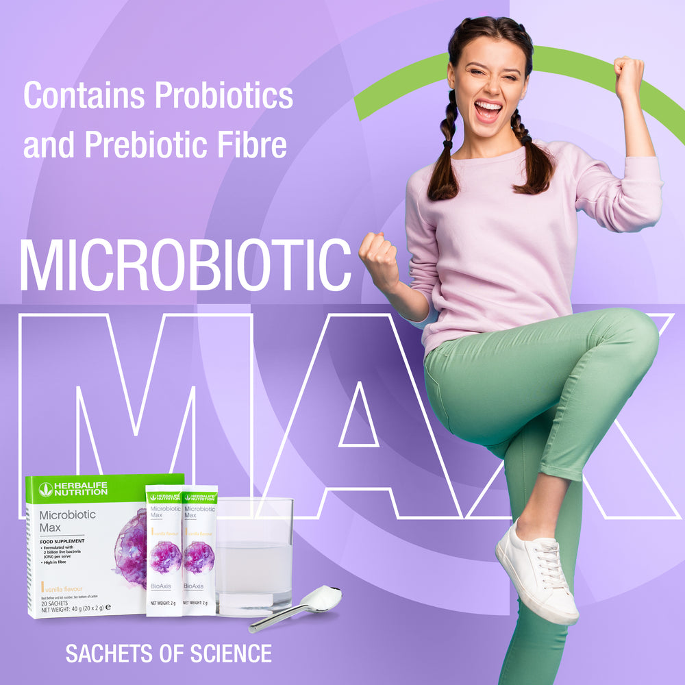 
                  
                    Load image into Gallery viewer, Energised and Happy lady with plaits in pale pink sweatshirt and pale green trousers Herbalife Nutrition Microbiotic Max box and sachets
                  
                