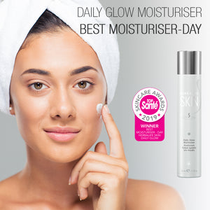 
                  
                    Load image into Gallery viewer, Herbalife Daily Glow Moisturiser next to lady in white hair turban applying the product to her cheek with Top Sante skincare award logo
                  
                